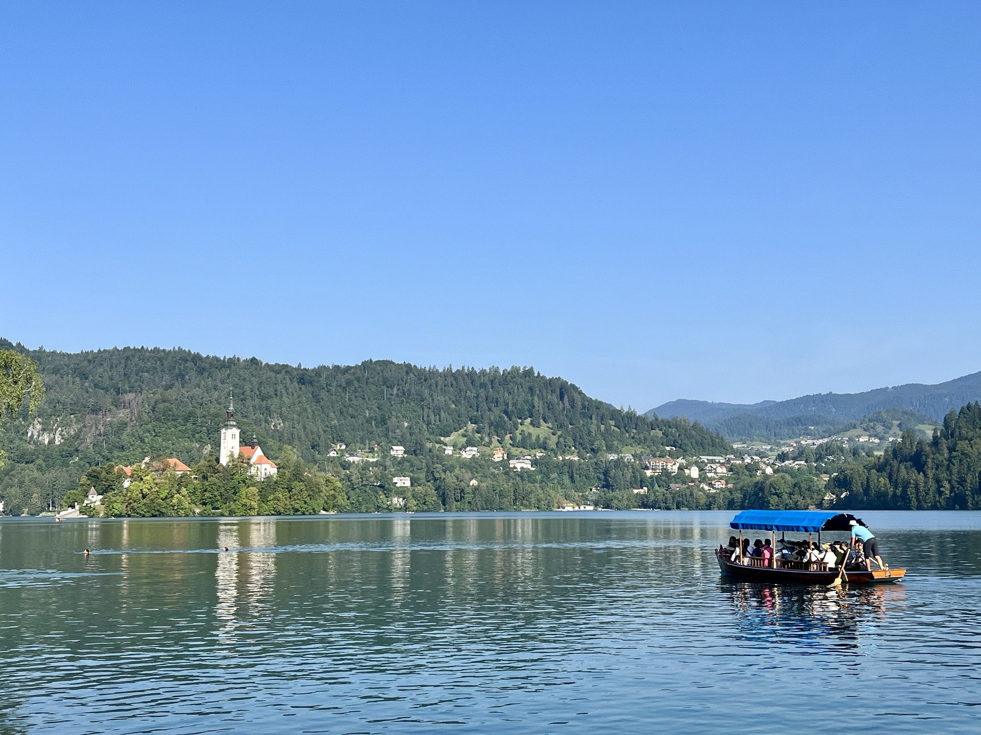 pletna boat going out to island on Lake Bled