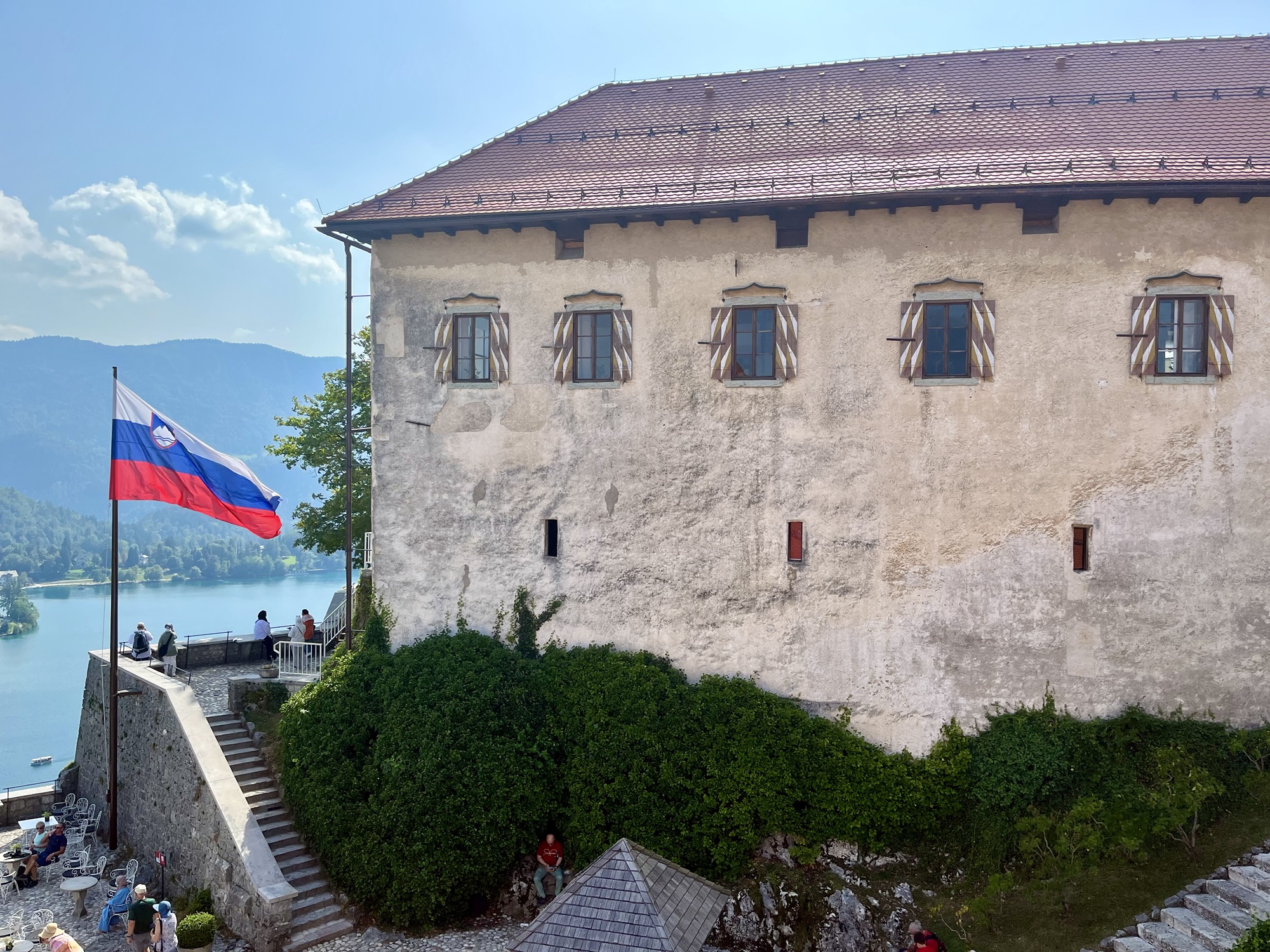 view if Bled Castle and the Slovenian Flag