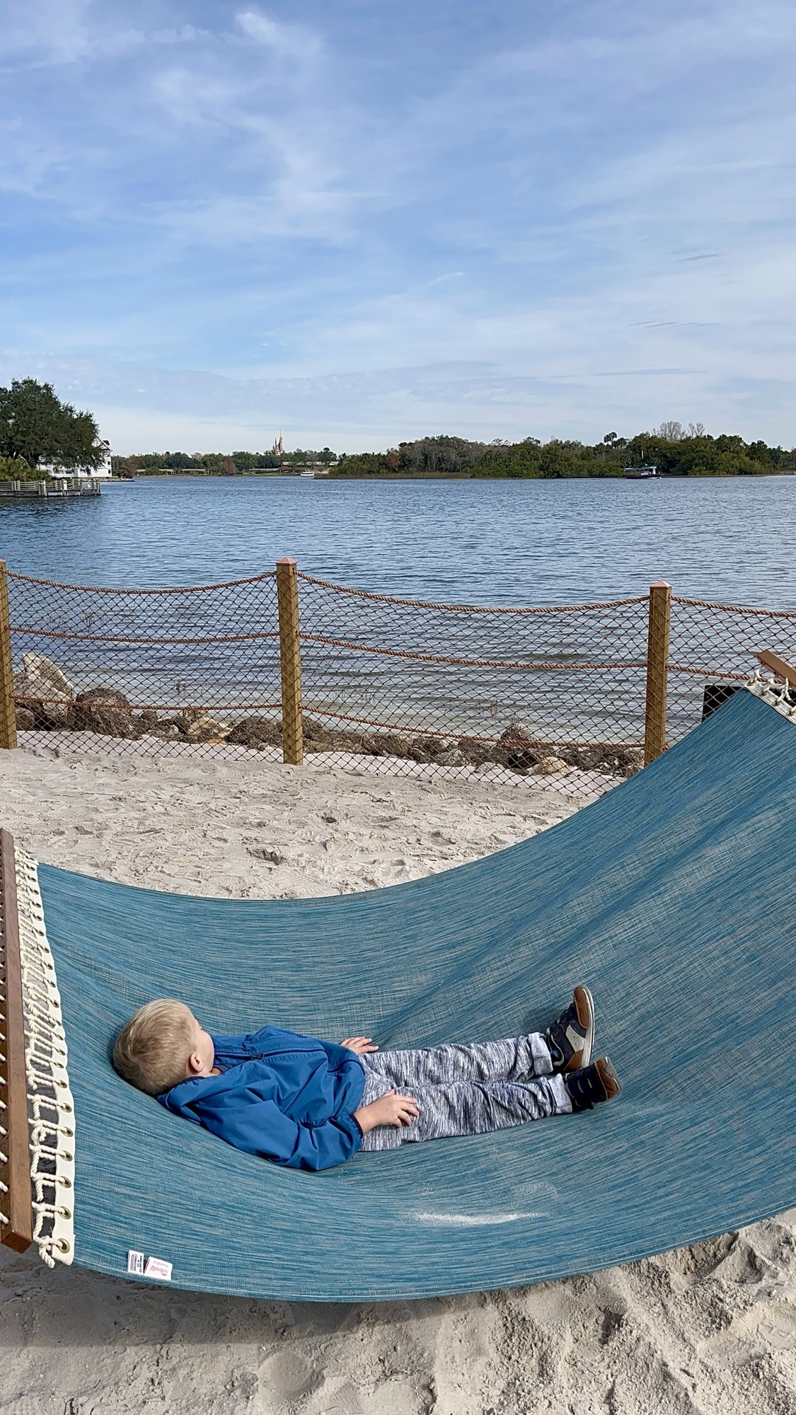 swinging on a hammock overlooking Seven Sea Lagoon at Disney World