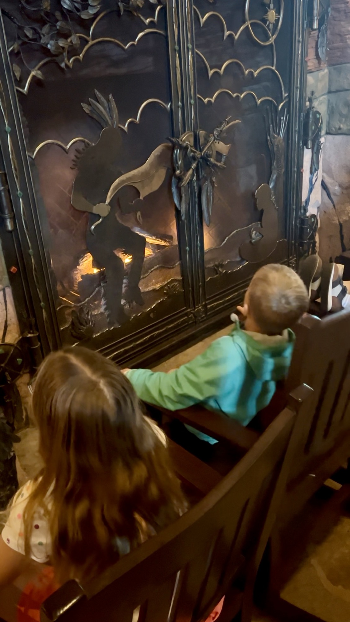 getting warm by the fireplace in Wilderness Lodge resort in Disney World